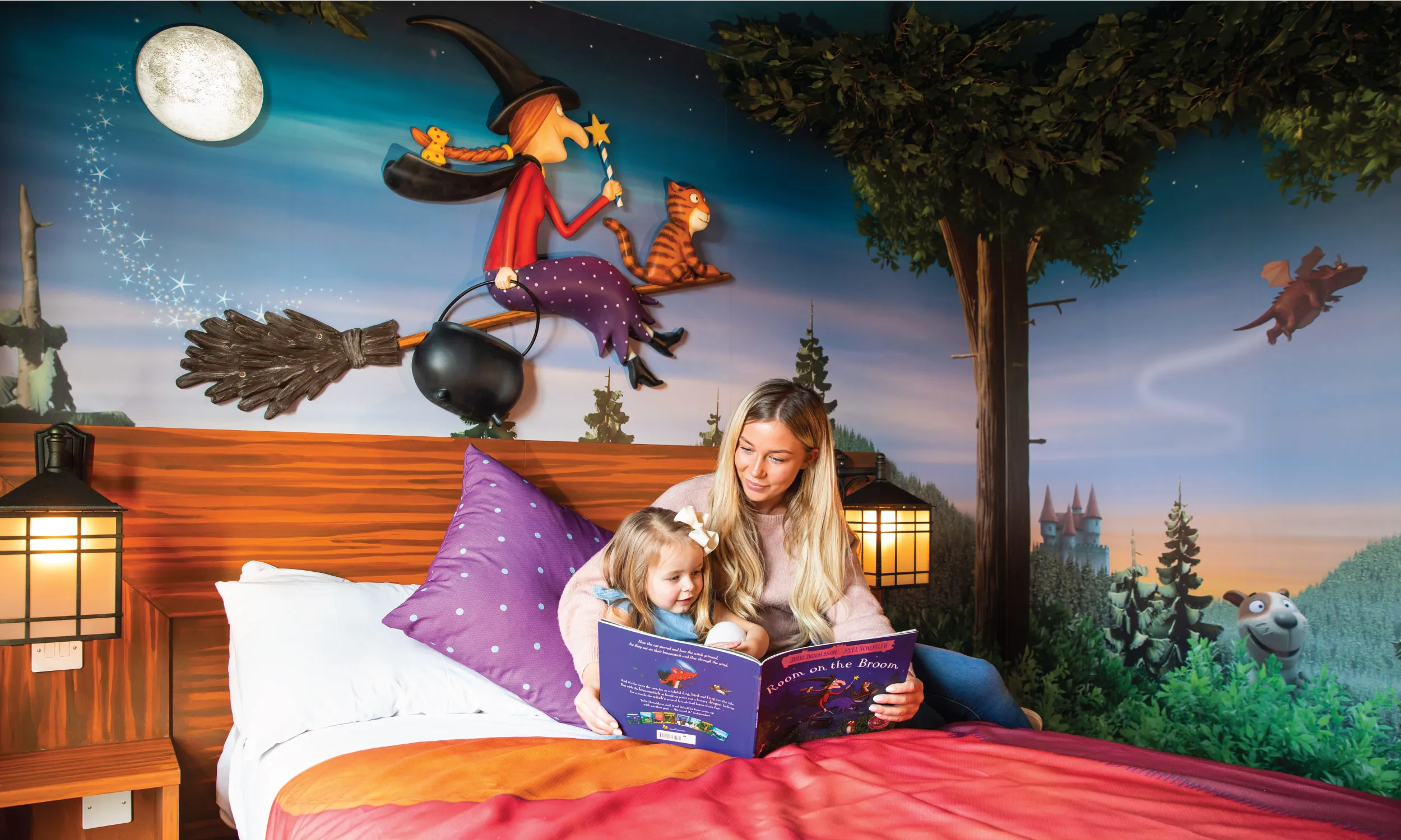 Woman and young girl in the Room on the Broom themed room