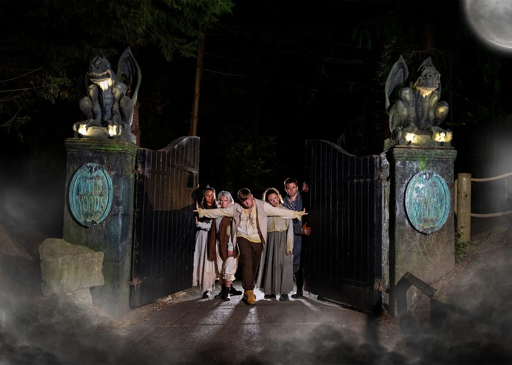 Halloween Villagers walking through gate at night 