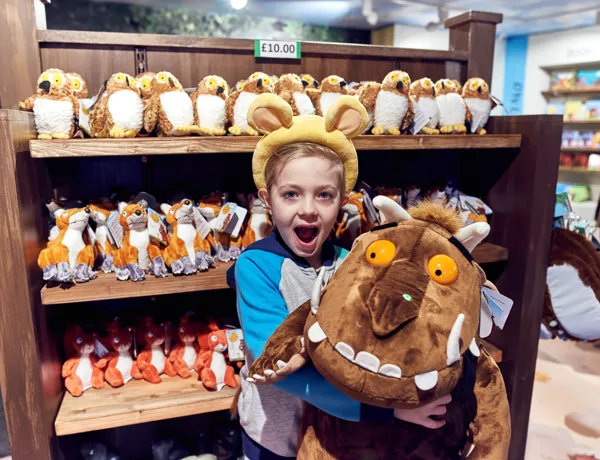 Child holding big Gruffalo toy