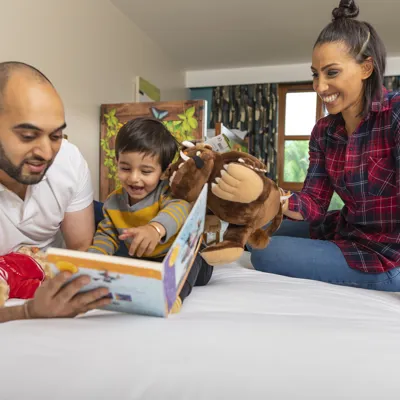 Room 1 Family reading book with Gruffalo toy