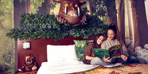 Gruffalo Hotel Room - parent reading to child on bed